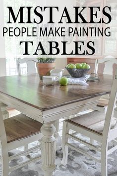 a white table with green apples on it