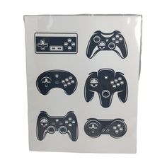 a white box with four different types of video game controllers on the front and side