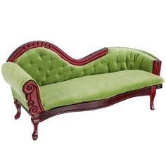 a green couch sitting on top of a wooden frame