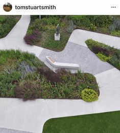 an aerial view of a garden with benches and flowers