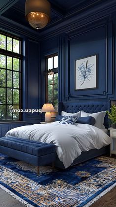 a bedroom with blue walls and carpeted flooring has a large bed in the middle