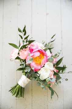 a bridal bouquet with pink and white flowers