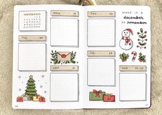 an open planner with christmas decorations on it