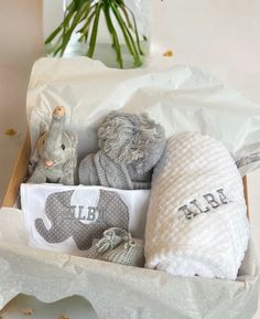 a baby gift box filled with blankets and toys