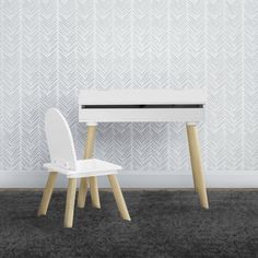 a white table and two chairs in front of a wallpapered room with grey carpet