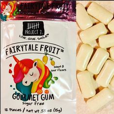 a bag of fairytale fruit gourmet gum next to a pile of candy