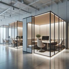 an office cubicle with glass partitions in the middle and two desks on each side