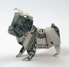 an origami dog made out of dollar bills