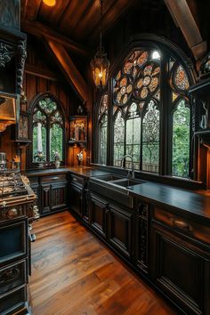 an old fashioned kitchen with wood floors and stained glass windows