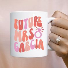 a person holding a coffee mug with the words future mrso garcia on it