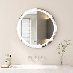 a bathroom sink with a mirror above it and a vase on the counter next to it