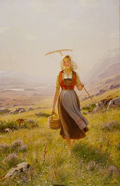 a painting of a woman carrying a basket and walking through a field with mountains in the background