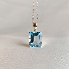 This stunning pendant is set in 14k Solid Yellow Gold with Natural Sky Blue Topaz  with utmost precision. It is a unique gemstone pendant for nearly every occasion and is completely hassle-free jewelry. ITEM DETAILS: * GEM: Sky Blue topaz * GEM Size: 10X12mm * GEM Shape: Octagon * Gem Weight: 6.80 carats * Gold Purity: 14KT  * Gold Weight: 0.91gram * Total Weight of the Pendant: 2.27 gram The Gold purity is guaranteed and it comes with an authentic 14KT gold hallmark. Since my items are handmade Emerald Cut Blue Topaz Necklace, Pretty Jewelry Necklaces, Handmade Jewelry Box, Gold Topaz, Blue Topaz Pendant, Topaz Jewelry, Horse Jewelry, Topaz Pendant, Jewelry Accessories Ideas