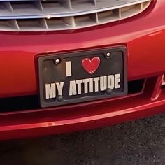 i love my attitude license plate on a red car with the word'i love my attitude'written on it