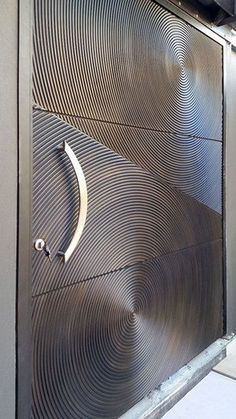 a large metal door with a handle on it