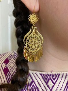 Beautiful Artisanal Mexican Traditional Earrings - Gold Plated Folkloric Earrings made by our Oaxaca Artisan Partners.  These earrings are typically worn for Traditional Folkloric Dances. They are the perfect accessory for a Fiesta themed party. These earrings are very lightweight.  Care * cloth wipe to clean * delicate care * wipe to dry Please email me your questions before buying. All of my items come from a smoke and pet free environment. I WILL BE PROCESS YOUR ORDER IN 1-2 DAYS. If you need Mexican Culture Accessories, Mexican Earrings Gold, Eloquii Earrings, Ceremonial Drop Earrings, Artisan Filigree Jewelry For Festivals, Ceremonial Dangle Earrings, Adjustable Filigree Earrings, Traditional Filigree Chandelier Earrings, Traditional Handmade Flower Earrings