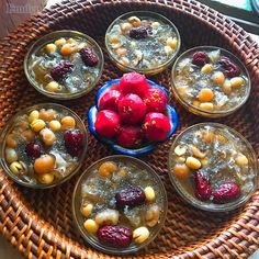 a wicker tray topped with small bowls filled with food