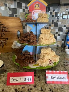 three tiered trays filled with food on top of a counter