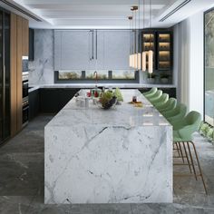 a kitchen with marble counter tops and green chairs in the center, surrounded by large windows