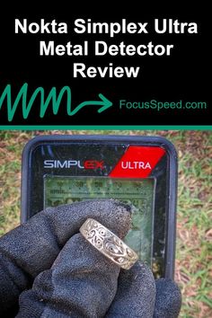 a hand holding a cell phone with the text nokia simplex ultra metal detector review