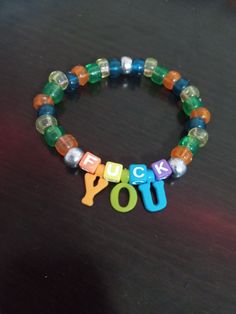 Cursed Bracelet, Perler Bead Bracelet Diy, Unhinged Bracelet Ideas, Kandi Friendship Bracelets, Weird Bracelets, Funny Beaded Bracelets, Funny Bracelet Ideas, Bracelet Ideas Kandi, Funny Kandi Bracelets