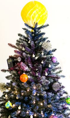 a small christmas tree with decorations on it