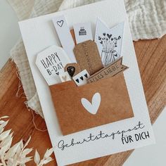 a greeting card with an envelope filled with cards