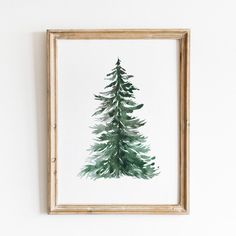 a watercolor painting of a pine tree in a frame on the wall above it