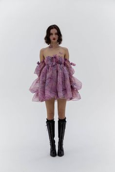 Emerge from your chrysalis in this enchanting off-the-shoulder mini dress, featuring a ruched seashell bust with a center bow. Adorned with bow-accented puff sleeves and a delicately puffed skirt, it emulates the soft flutter of wings. The purply pink Wingdye print pays homage to the breathtaking sight of the annual bu Silkie Dress, Cocktail Mini Puff Sleeve Dress With Ruffles, Evening Ruffled Bubble Dress In Mini Length, Cocktail Puff Sleeve Mini Dress With Ruffles, Feminine Off-shoulder Puff Sleeve Party Dress, Spring Cocktail Mini Dress With Voluminous Skirt, Mini Dress With Voluminous Skirt For Cocktail In Spring, Cocktail Mini Dress With Voluminous Skirt For Spring, Spring Mini Dress With Ruffles And Flowy Fit