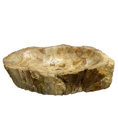 a large wooden bowl sitting on top of a table