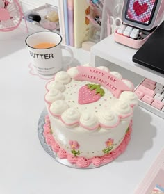 a cake sitting on top of a white table