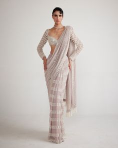 Ash pink chandelier pearl drop saree clubbed with a hand-embroidered full-sleeve blouse.From Vvani Vats Piroi's collection.DELIVERY TIMEPlease allow 8-12 weeks for your outfit to arrive.FABRIC DETAILSGeorgetteProfessional cleaning only. Couture, Haute Couture, Batch Party Outfits, Pre Draped Saree, Full Sleeves Blouse Designs, Heavy Saree, Ash Pink, Pink Chandelier, Draped Saree