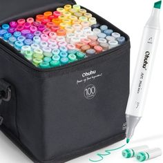 the crayon pencils are in a black case and next to it is a white marker