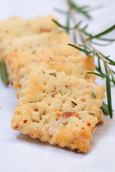 crackers with rosemary sprigs on white cloth