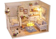 a doll house is shown with furniture and decor