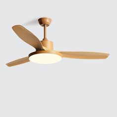 a wooden ceiling fan with a light on it's side and a wood blade