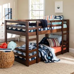 a bunk bed sitting next to a window in a bedroom on top of a rug