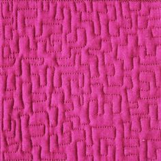 a close up view of a pink rug