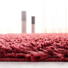 a red rug is sitting on the floor