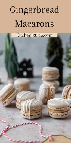 some cookies with icing sitting on top of a table next to candy canes