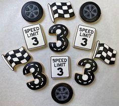 decorated cookies with numbers and race cars on them for birthdays or special occasiones