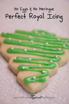 some cookies with green icing on top of each other and the words perfect royal icing