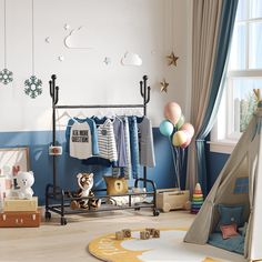 a child's room with toys and decorations on the floor, including clothing racks