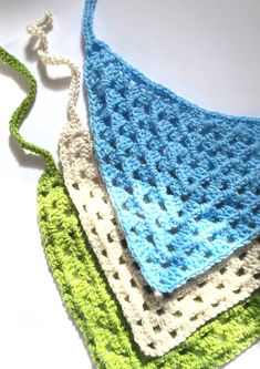 three crocheted dishcloths sitting on top of each other