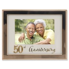 a 50th anniversary photo frame with an older man and woman hugging each other in the center