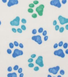 blue and green paw prints on white paper