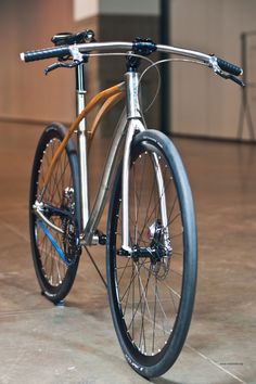 a bike is shown on the floor in an empty room with no people around it