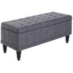 a gray bench with black legs and buttons