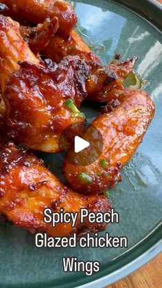 spicy peach glazed chicken wings on a plate with the words, spicy peach glazed chicken wings