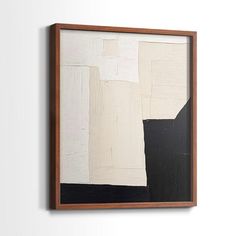 an abstract painting hanging on the wall